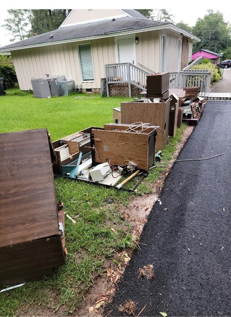 Furniture and debris at the curb — Mels Sanitation / Junk Removal