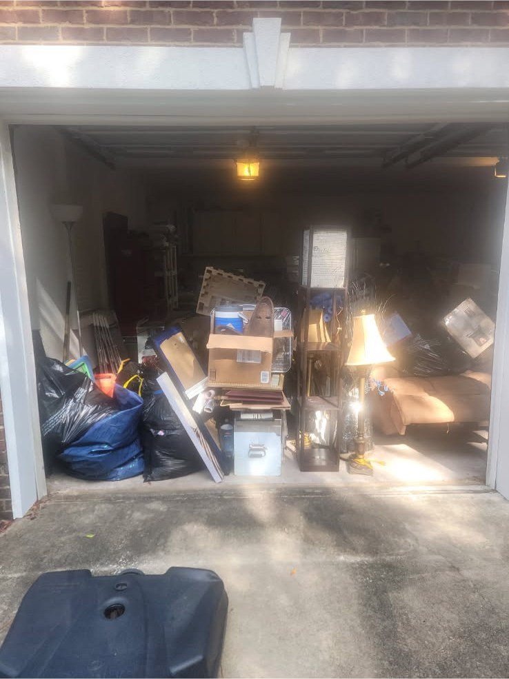 Packed garage before cleanout — Mels Sanitation / Junk Removal
