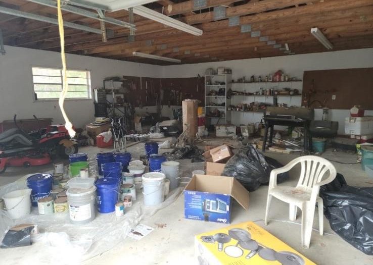 Cluttered garage cleanout — Mels Sanitation / Junk Removal