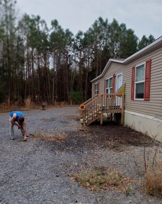 Yard cleanup in progress — Mels Sanitation / Junk Removal