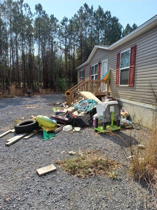 Junk pile at a home — Mels Sanitation / Junk Removal